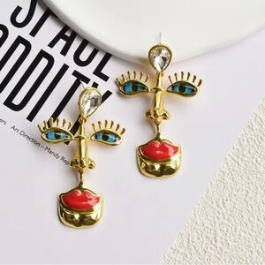 Artistic Face Earrings with Gold and Red Accents